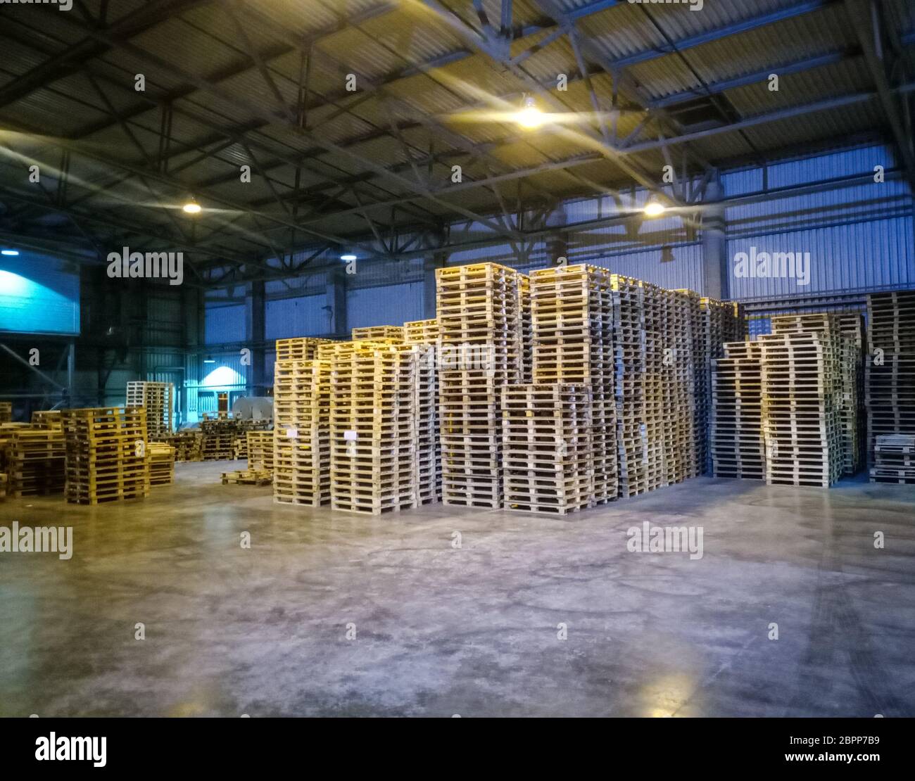 Pallet racks inside a cement plant. Loading shop of a cement plant ...