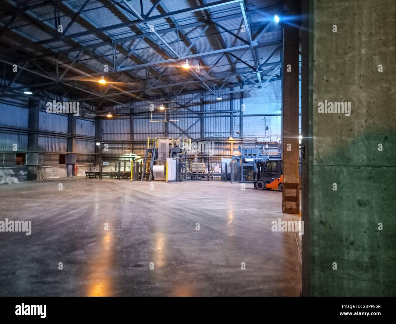 Pallet racks inside a cement plant. Loading shop of a cement plant ...