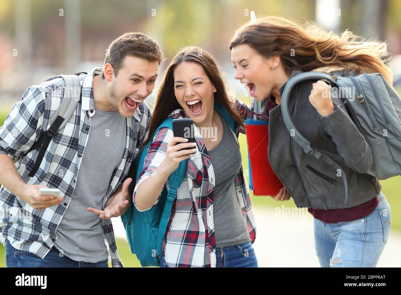 Education celebrating happy surprised exam results girls hi-res stock ...