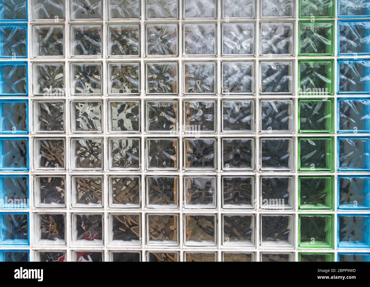 The image shows a wall made of coloured glass blocks Stock Photo Alamy
