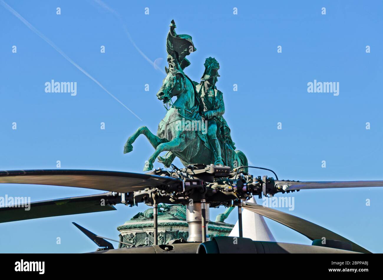 equestrian monument of emperor Charles at the heroes place in Vienna behind the rotor of a modern combat helicopter, Austria Stock Photo