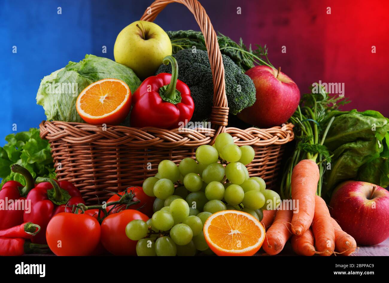 Fresh organic fruits and vegetables in wicker basket Stock Photo - Alamy