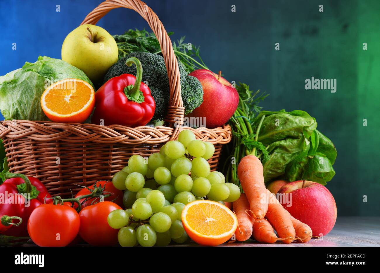 Fresh organic fruits and vegetables in wicker basket Stock Photo - Alamy
