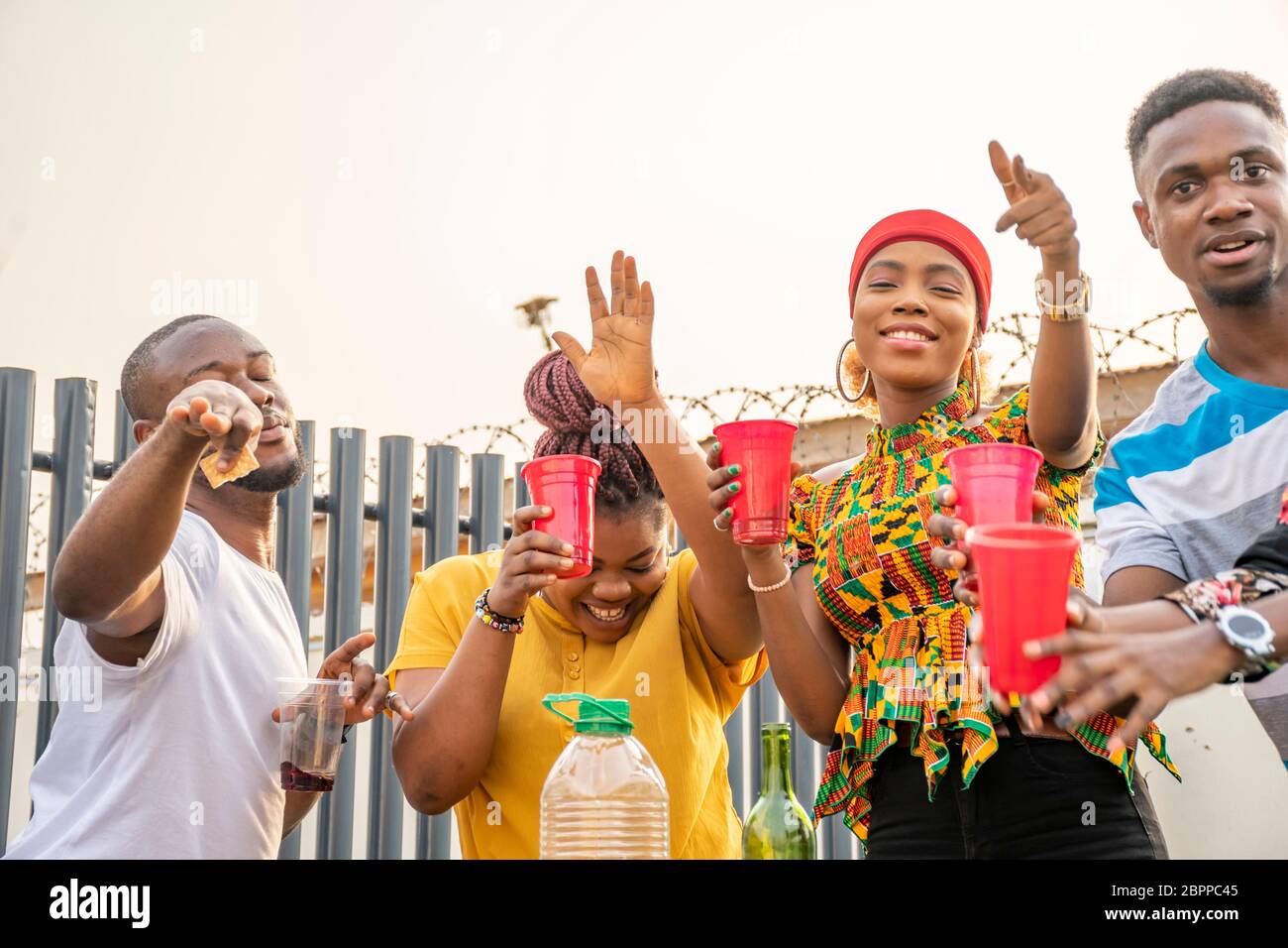 young african adults throwing a party, having fun Stock Photo Alamy