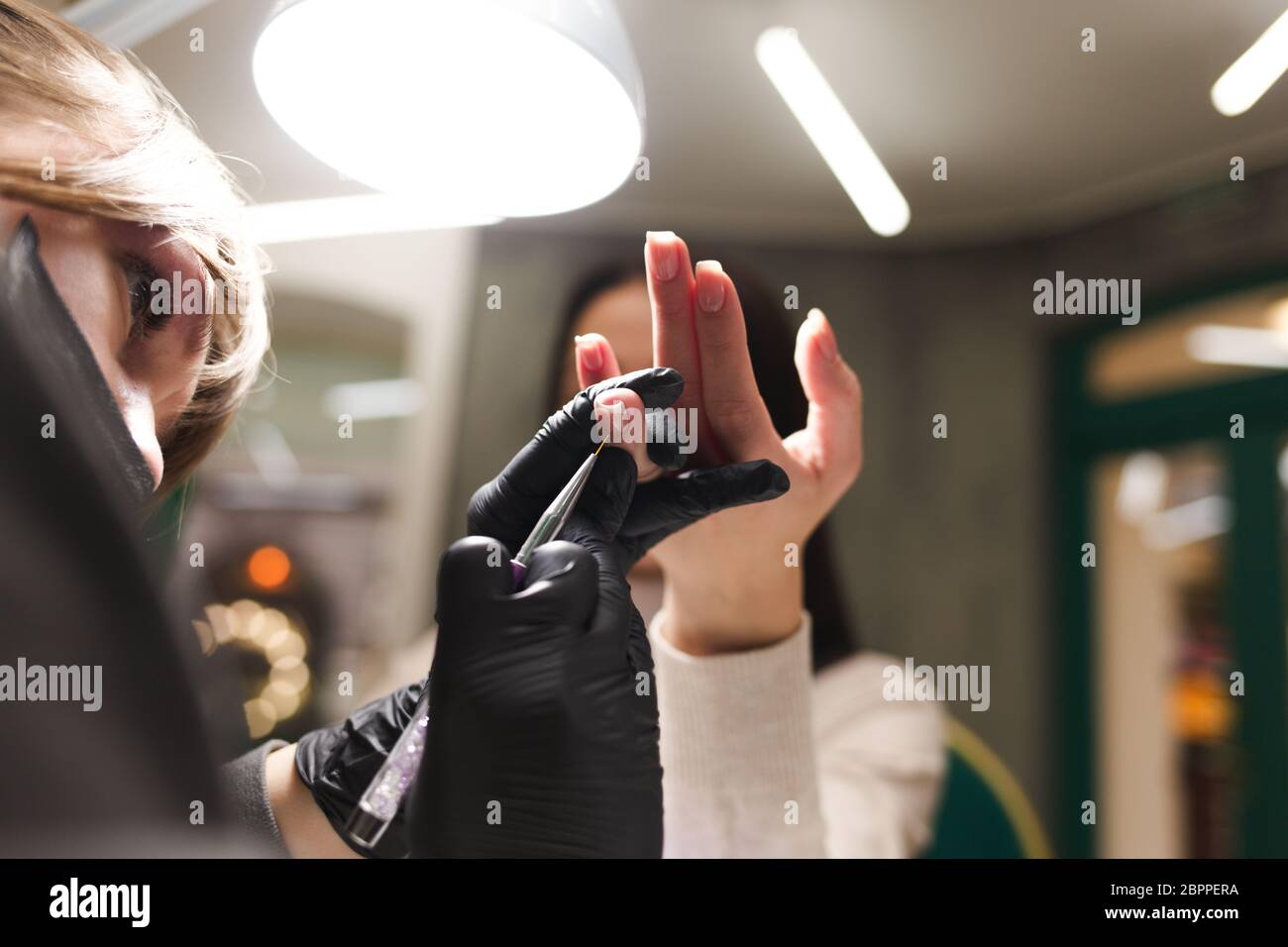 Cuticle care during a manicure process in a nail salon Stock Photo Alamy