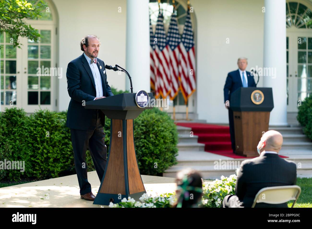 Ben Ross of Brackish Bowties and Mask by Makers of Charleston, South Carolina delivers remarks as President Donald Trump looks on, during the Presidential Recognition Ceremony: Hard Work, Heroism, and Hope in the Rose Garden of the White House May 15, 2020 in Washington, D.C. The event honored front line workers battling the COVID-19, coronavirus pandemic. Stock Photo