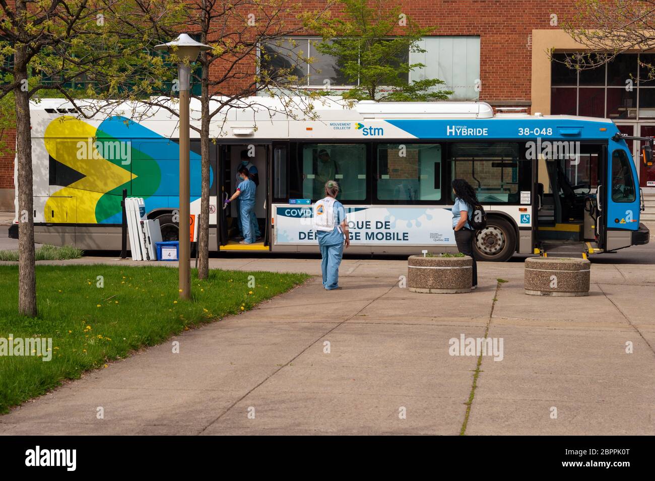 Montreal, CA - 19 May 2020: A STM city bus transformed into a mobile COVID-19 testing clinic on Fullum Street Stock Photo