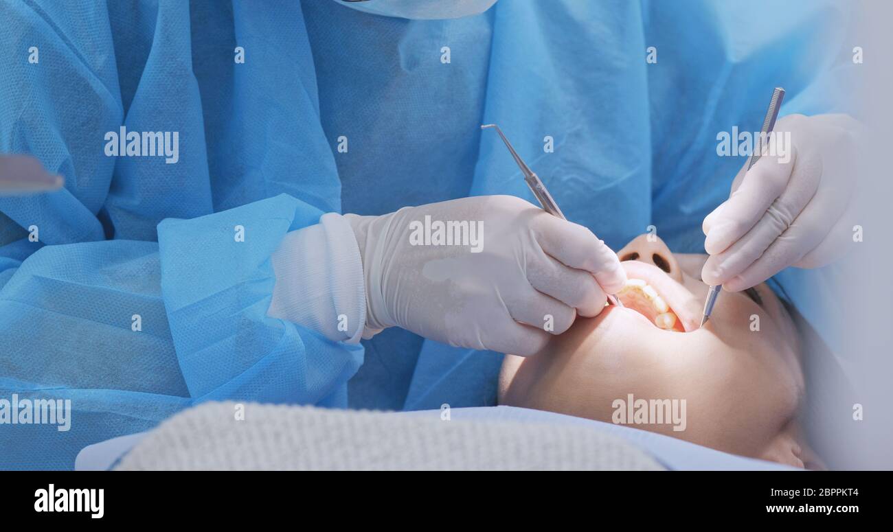 Patient having ultrasound cleaning at dental clinic Stock Photo Alamy