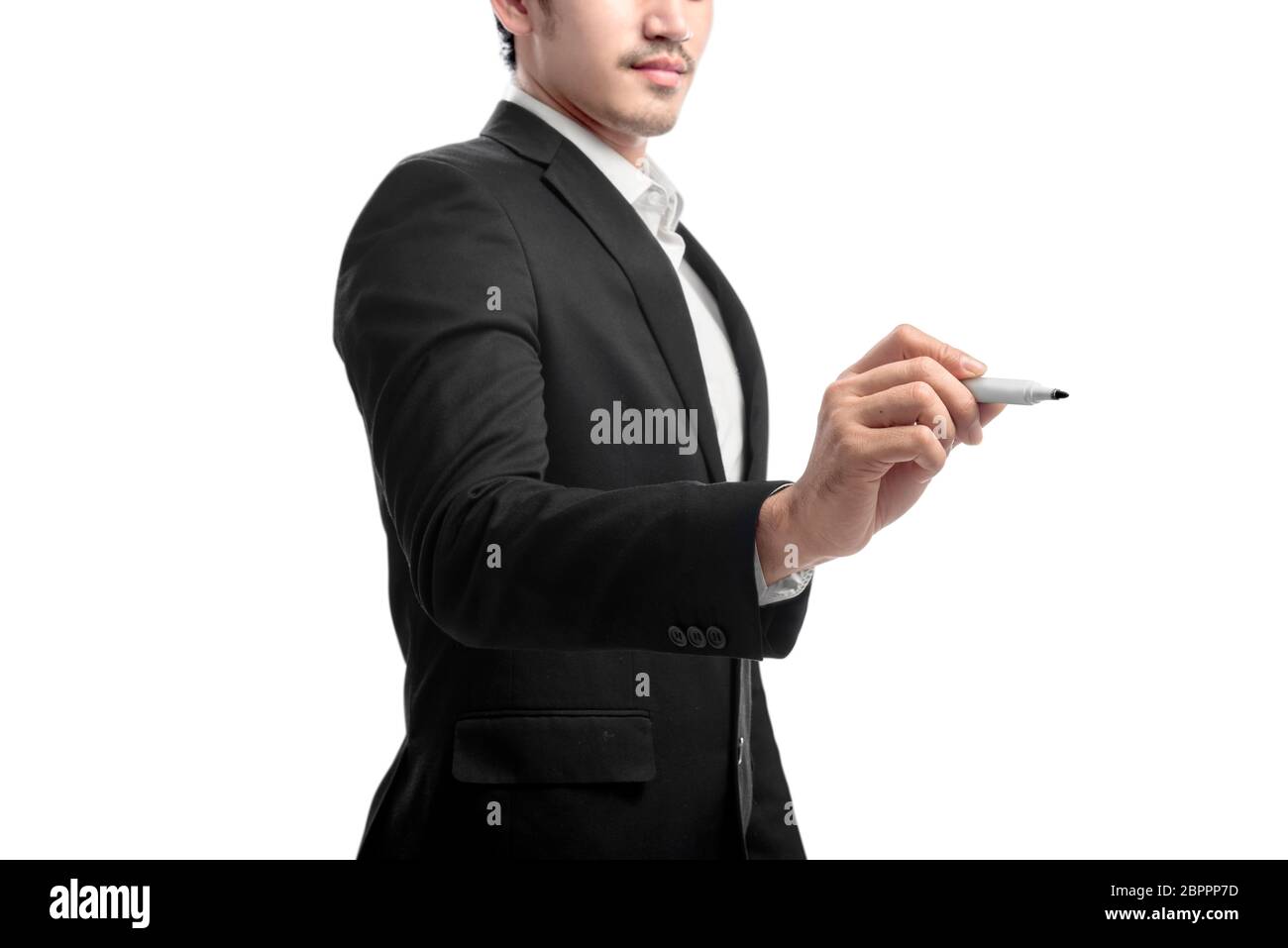 Young asian businessman using marker to write something isolated over white background Stock Photo