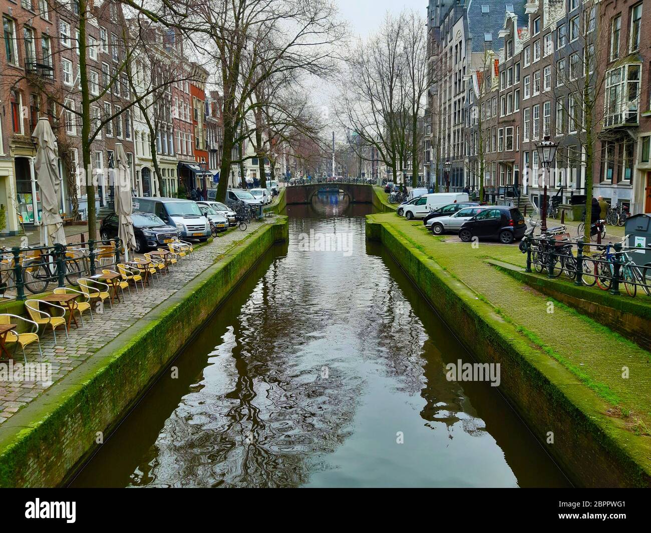 symmetry and charm of the canals of amsterdam among the daily Dutch ...