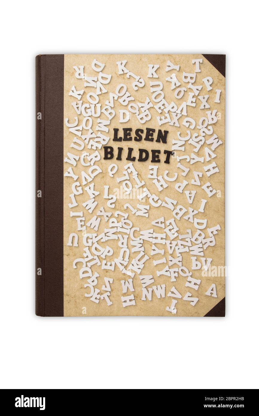 Concept: Lesen bildet in german language means Reading educates - Reading educates in german with Toy Letters and a old Book on white background Stock Photo
