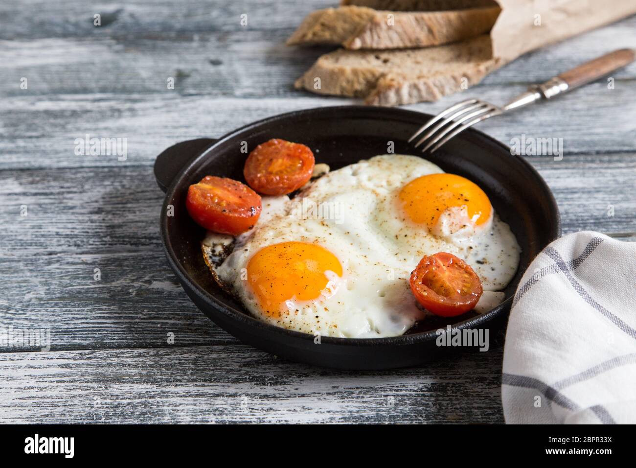 Fried egg. Close up view of the fried egg on a frying pan Stock Photo ...