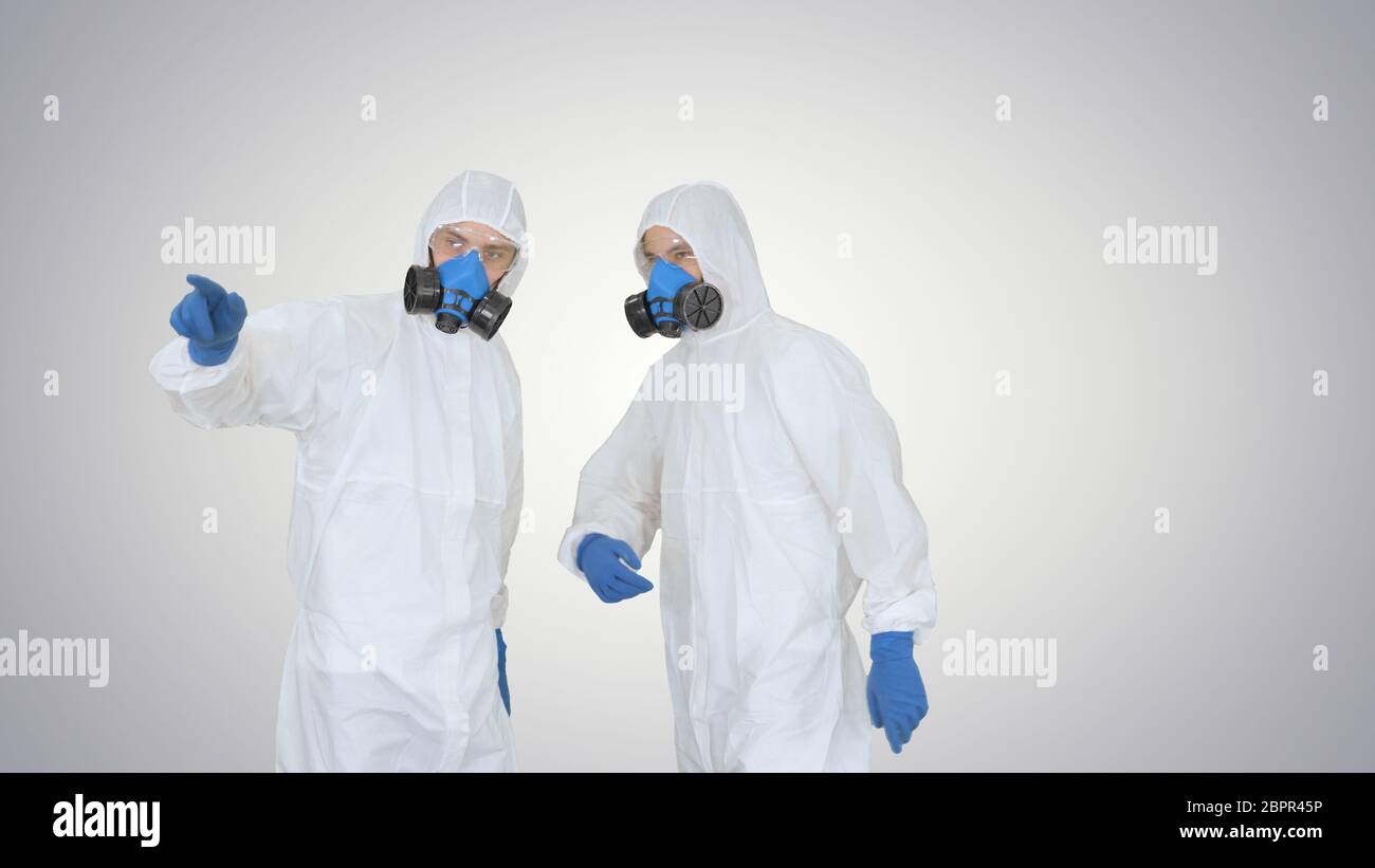 Disinfection team is called to help on gradient background. Stock Photo
