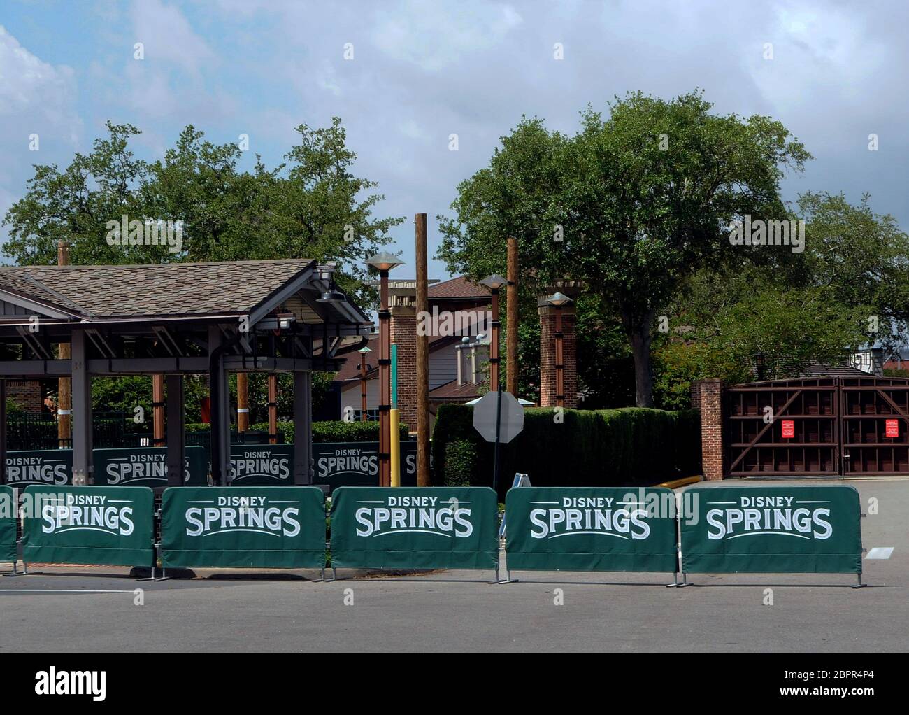 https://c8.alamy.com/comp/2BPR4P4/barricades-and-closed-gates-are-seen-at-the-entrance-to-disney-springs-at-walt-disney-world-a-day-before-the-retail-dining-and-entertainment-complex-begins-a-phased-reopening-following-the-closure-of-the-theme-park-on-march-16-2020-due-to-the-coronavirus-pandemic-all-visitors-to-disney-springs-will-be-required-to-wear-face-coverings-and-submit-to-temperature-checks-2BPR4P4.jpg