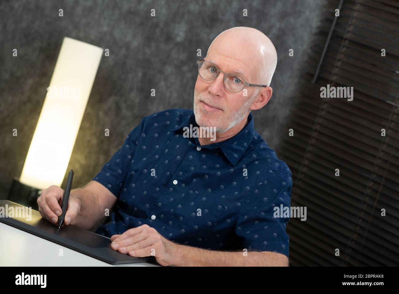 a senior designer using graphic tablet at office Stock Photo