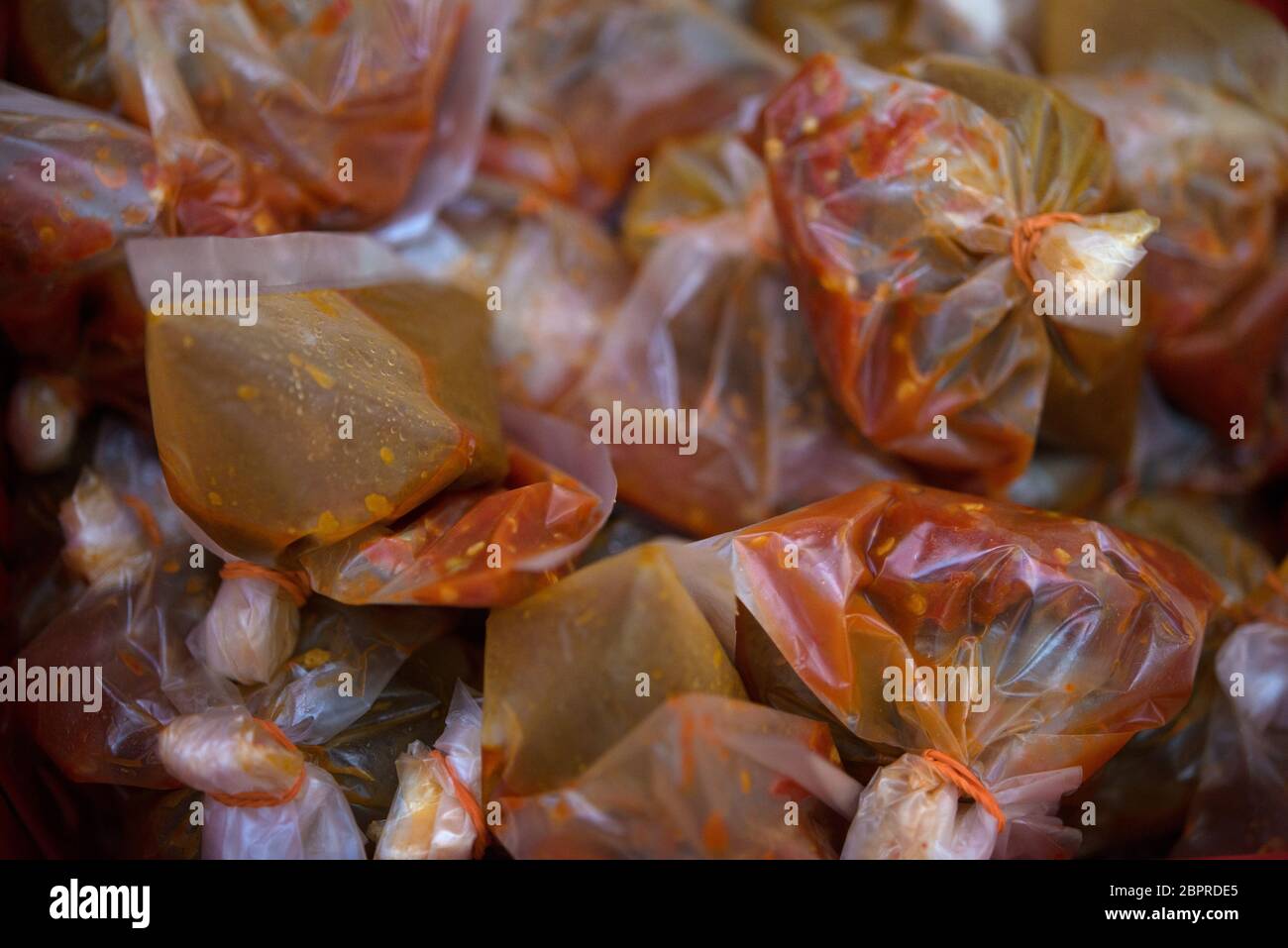 Chili sauce pack in plastic bag ready for takeaway Stock Photo - Alamy