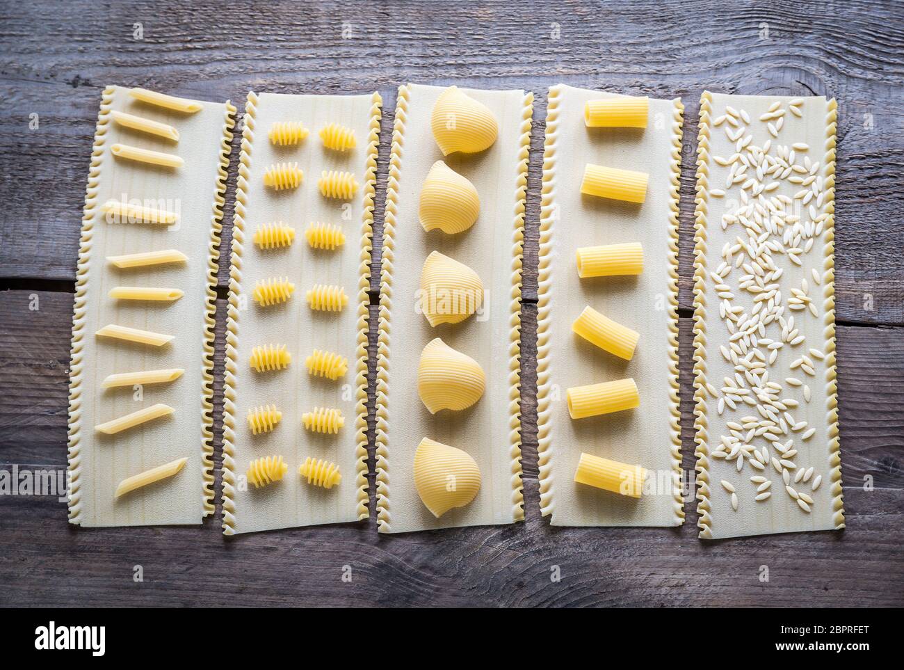 Various types of pasta on lasagne sheets Stock Photo Alamy