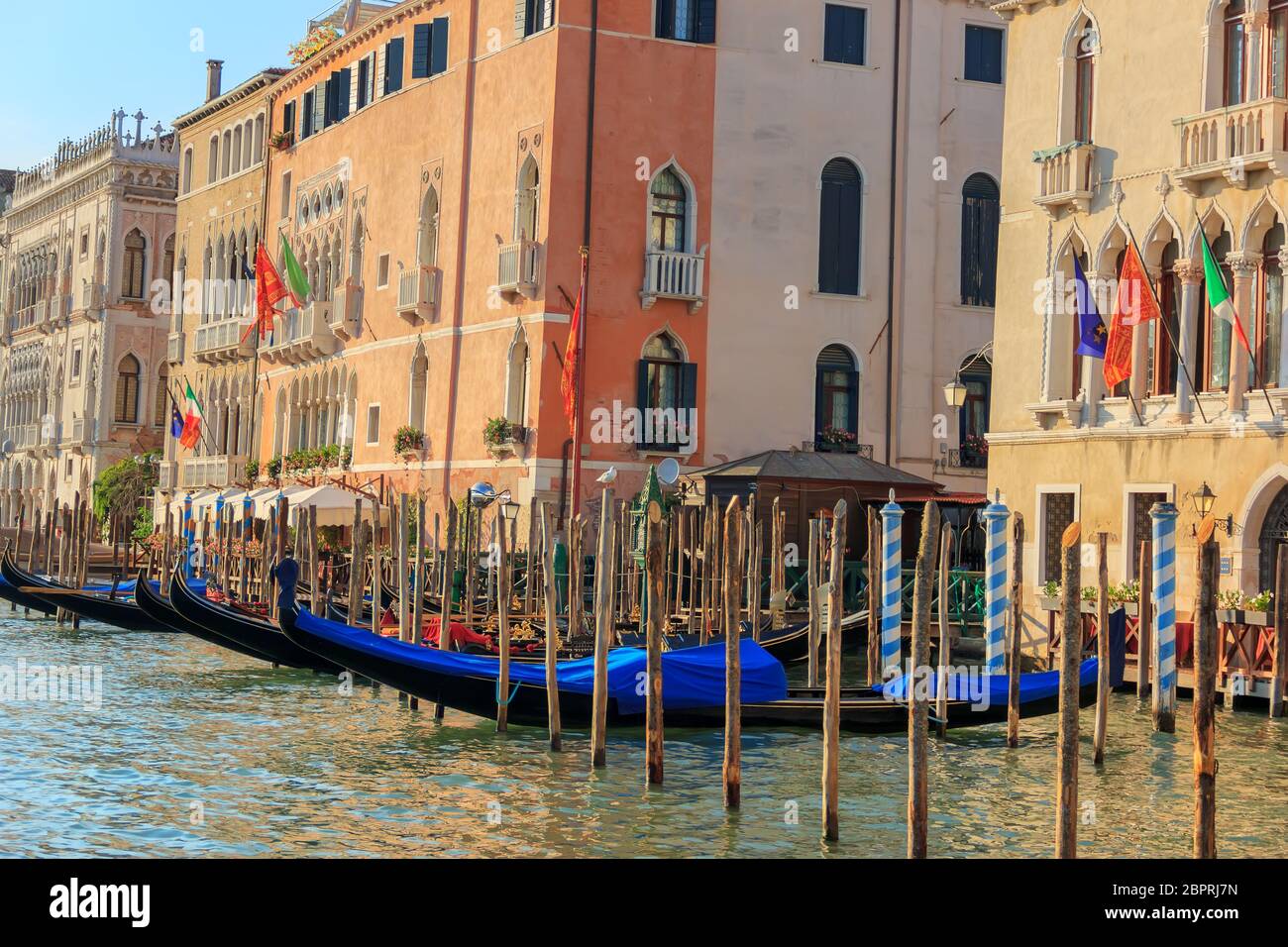 Venice Grand Canal with gondolas, palaces and piers, Italy, summer view. Stock Photo