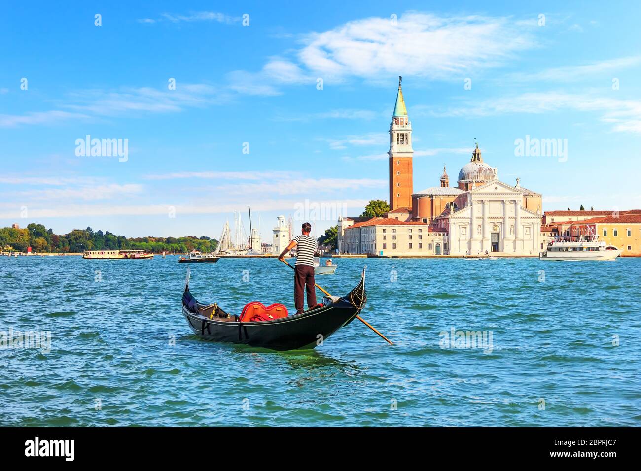 Venetian gondolier near San Giorgio Maggiore Island, Venice, taly. Stock Photo