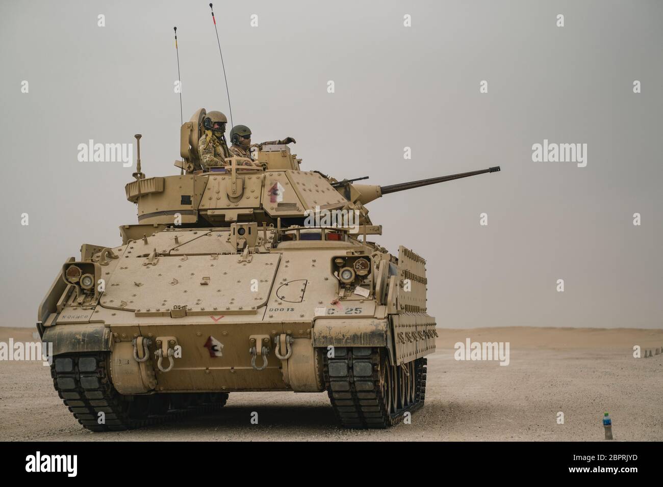 U.S. Soldiers with the 1-150th Cavalry Regiment, deployed from the West Virginia National Guard, stage their Bradley Fighting Vehicle for live-fire training May 4, 2020 in the U.S. Army Central region. The unit conducts ranges to maintain battlefield capabilities including reconnaissance, fire and maneuver, and “hunter-killer” engagement. (U.S. Army photo by Sgt. Angela O’Hearn) Stock Photo