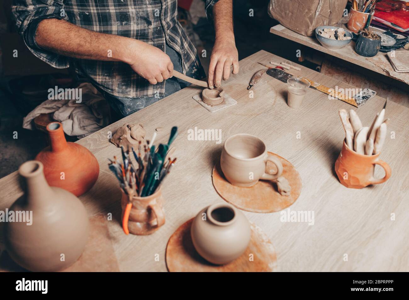 Process of creating a clay cup in pottery Stock Photo Alamy