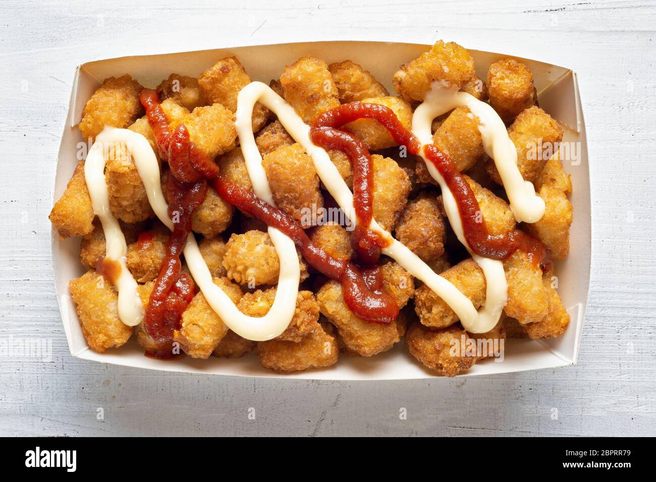 close up of rustic fried golden potato tater tots Stock Photo Alamy