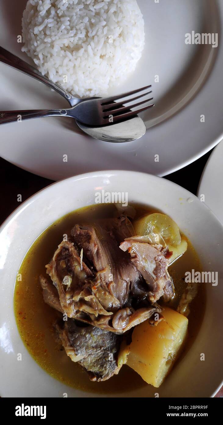 Fish head soup served in street shop in Bali Stock Photo Alamy