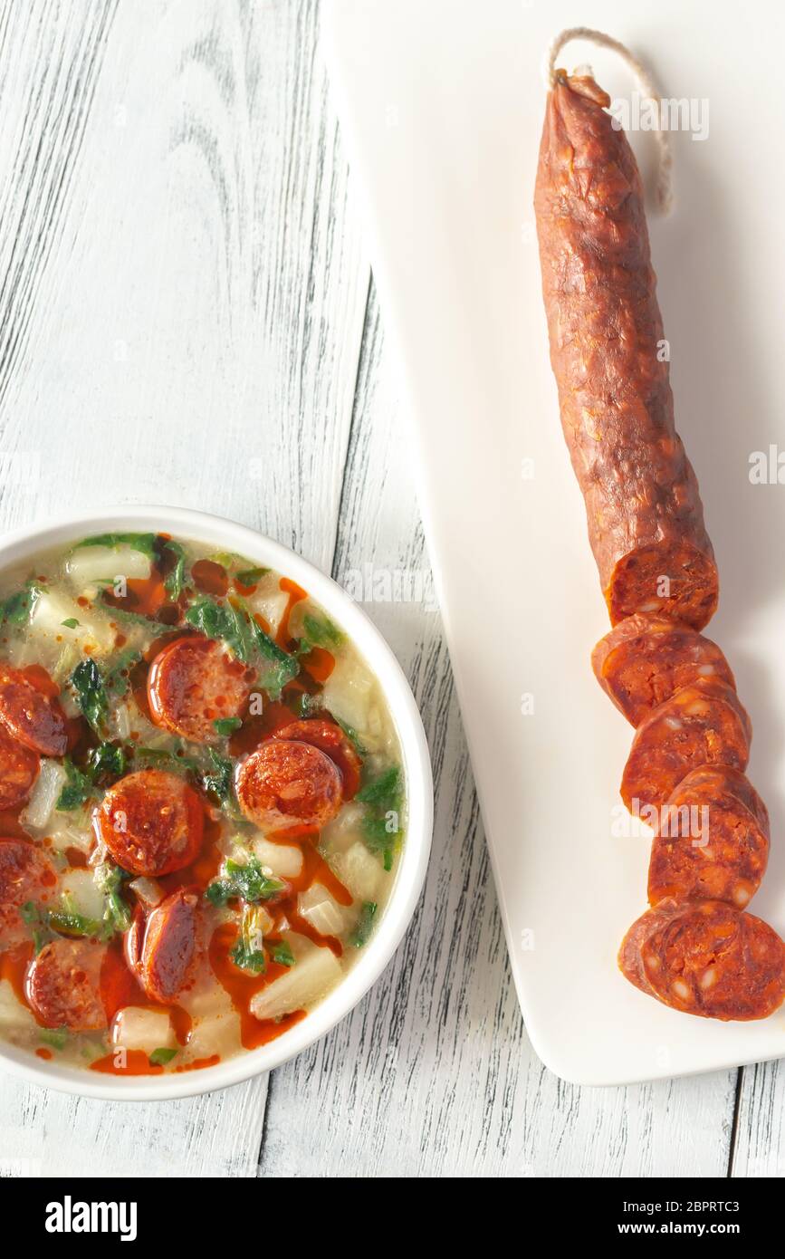 Portion of Portuguese Caldo verde soup with chorizo sausage Stock Photo