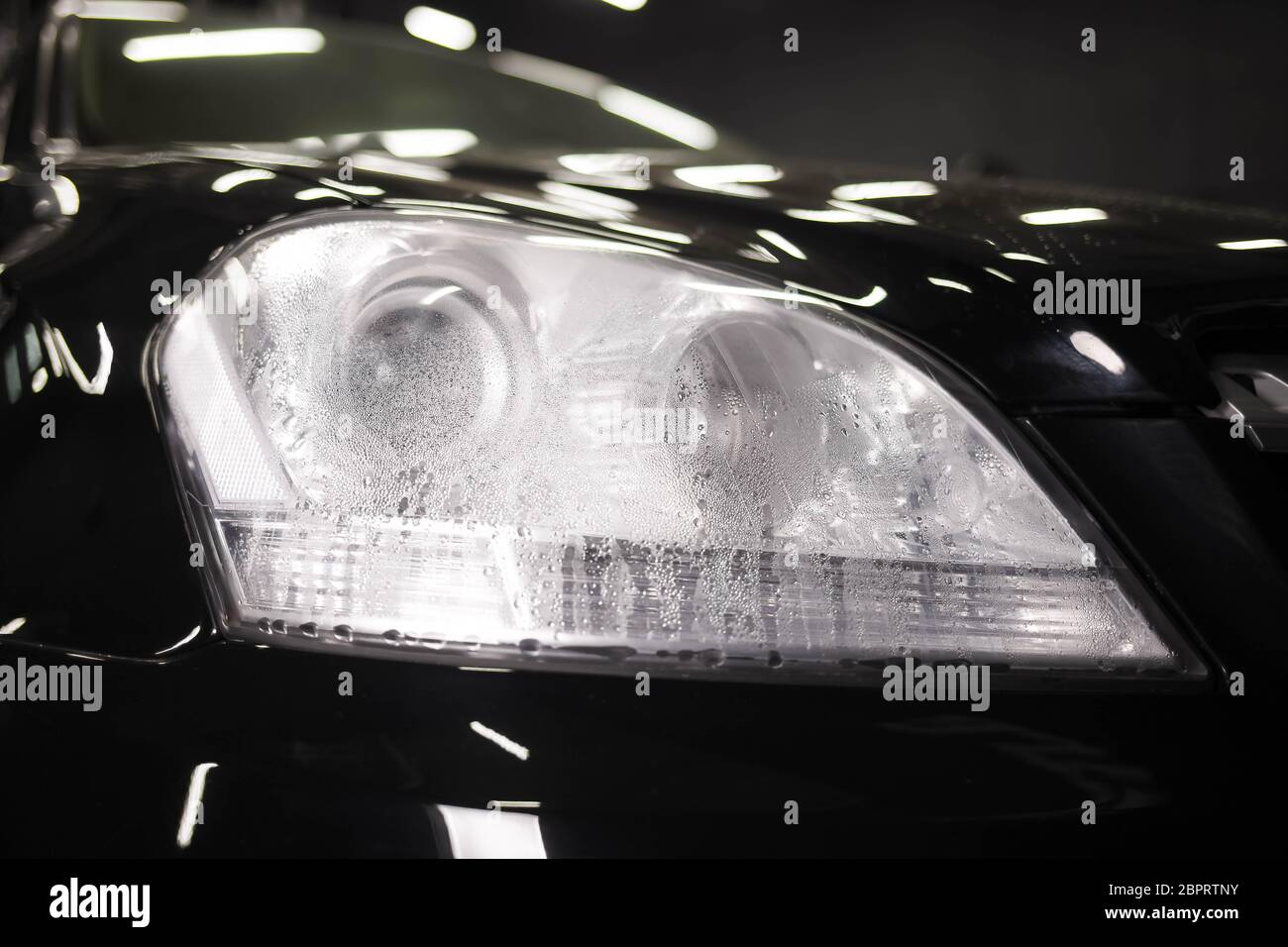 Moisture inside the car headlight Stock Photo Alamy