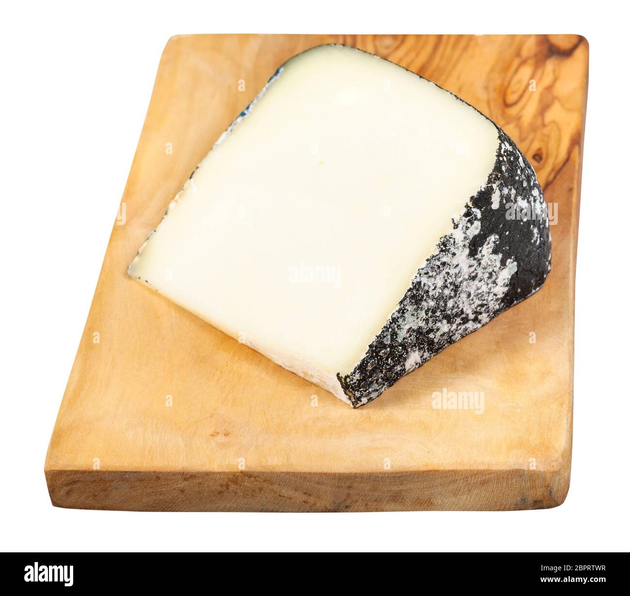 piece of local italian Perla Nera sheep's milk cheese on olive wood cutting board isolated on white background Stock Photo