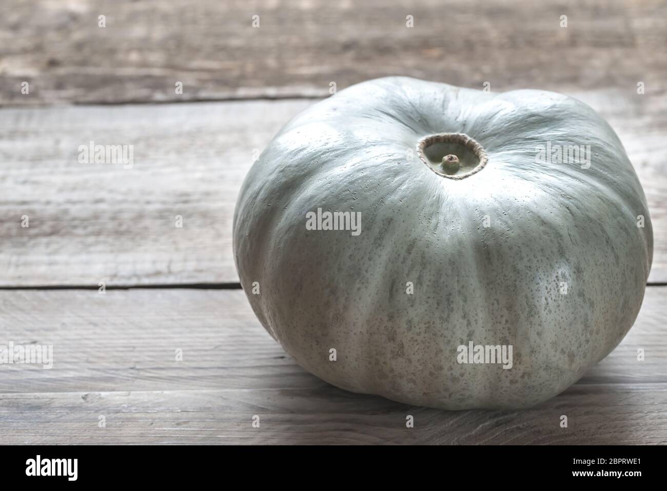 Ripe pumpkin on the wooden background Stock Photo - Alamy