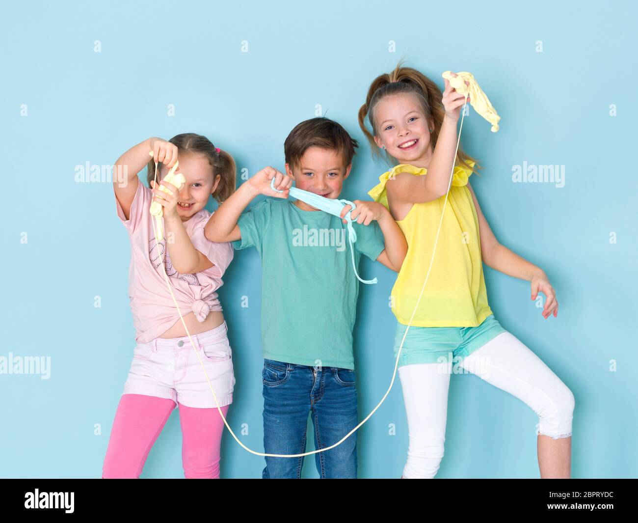 Two Beautiful And Funny Girls And One Cool Boy Playing With A Lot Of Slime In Front Of Blue Background And Having A Lot Of Fun Stock Photo Alamy Two Beautiful And Funny Girls And One Cool Boy Playing With A Lot Of Slime In Front Of Blue Background And Having A Lot Of Fun Stock Photo Alamy
