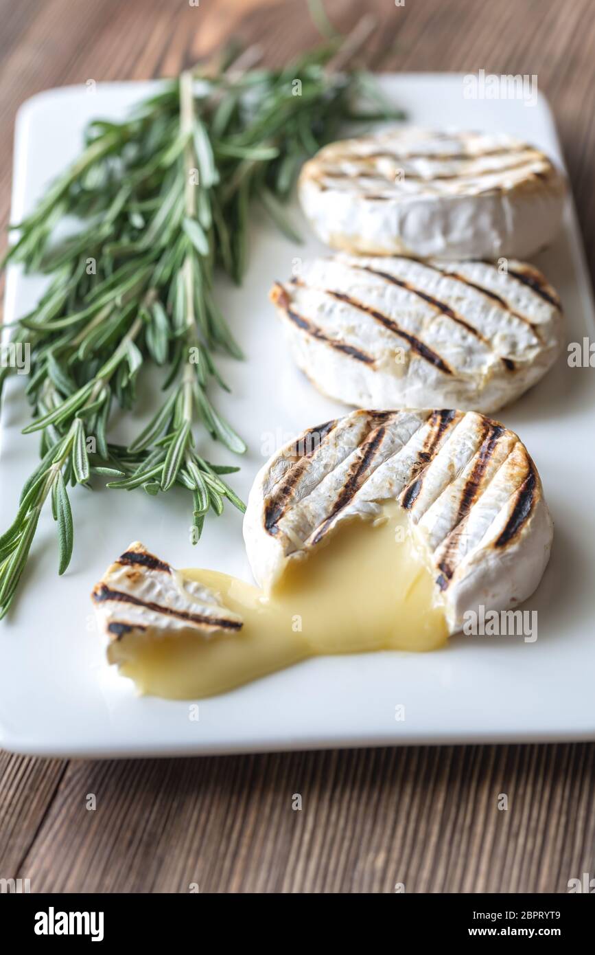 Grilled Camembert cheese with fresh rosemary Stock Photo Alamy