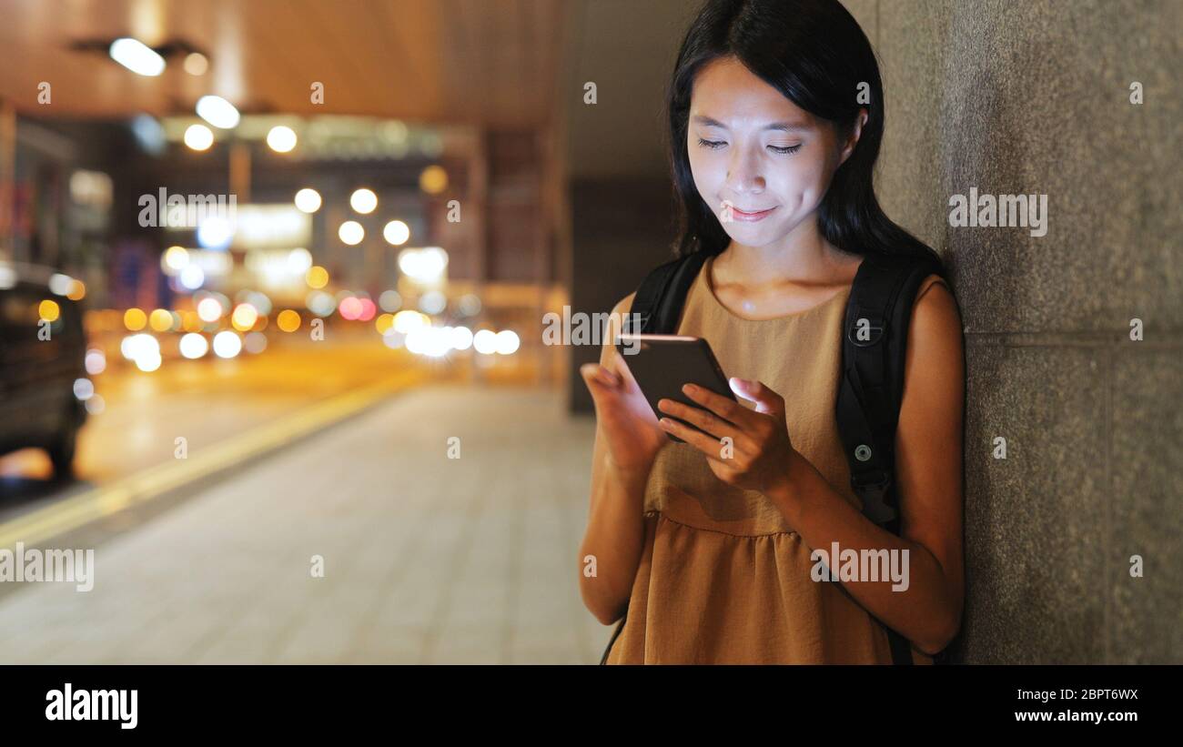 Woman use of mobile phone at night Stock Photo - Alamy