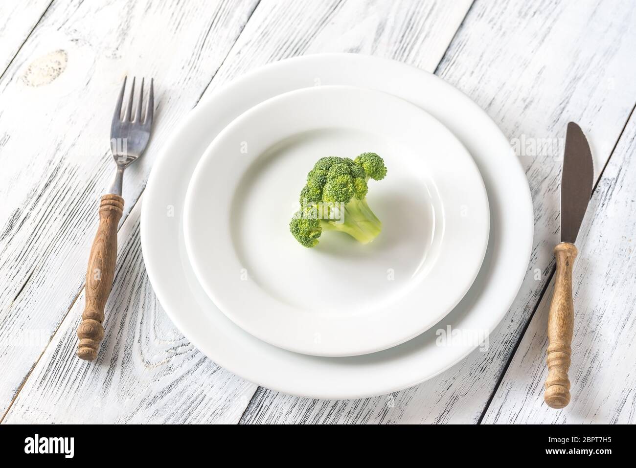 Fresh broccoli on the white plate Stock Photo