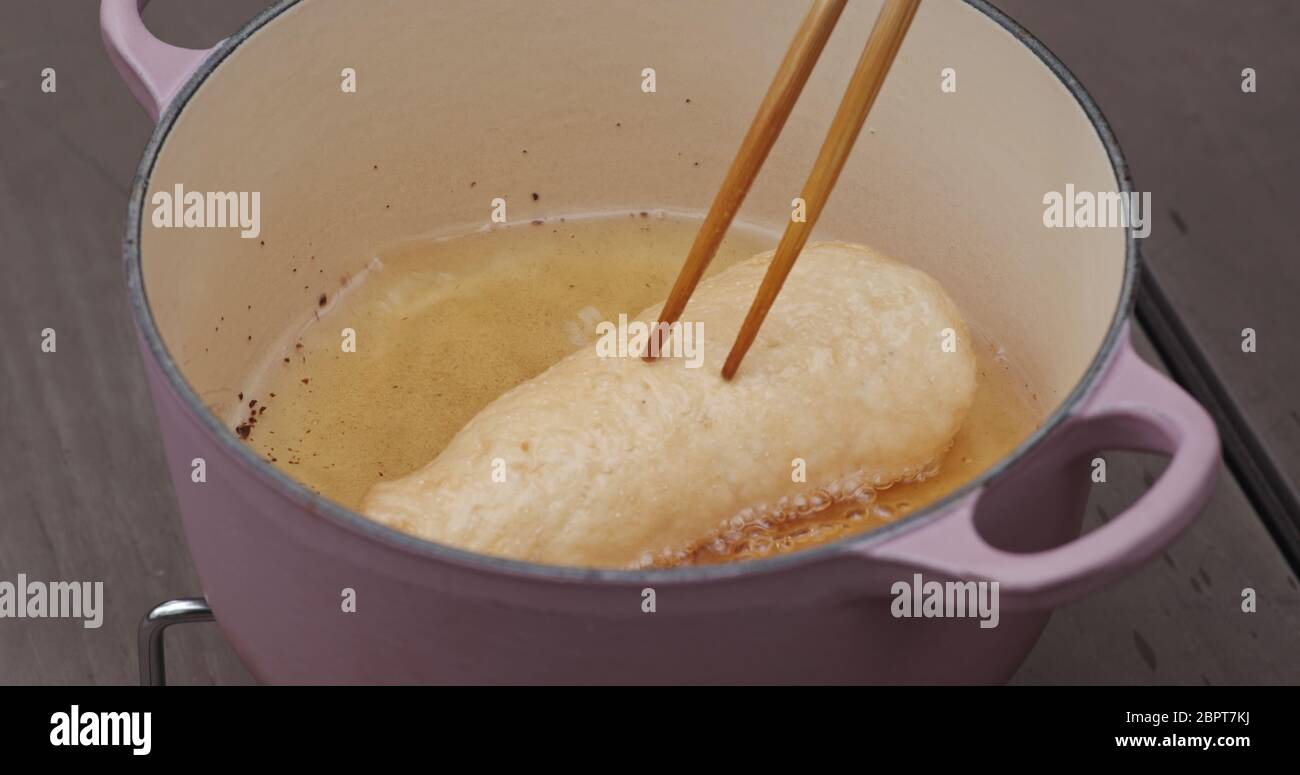 Cook prawn cracker in oil Stock Photo Alamy