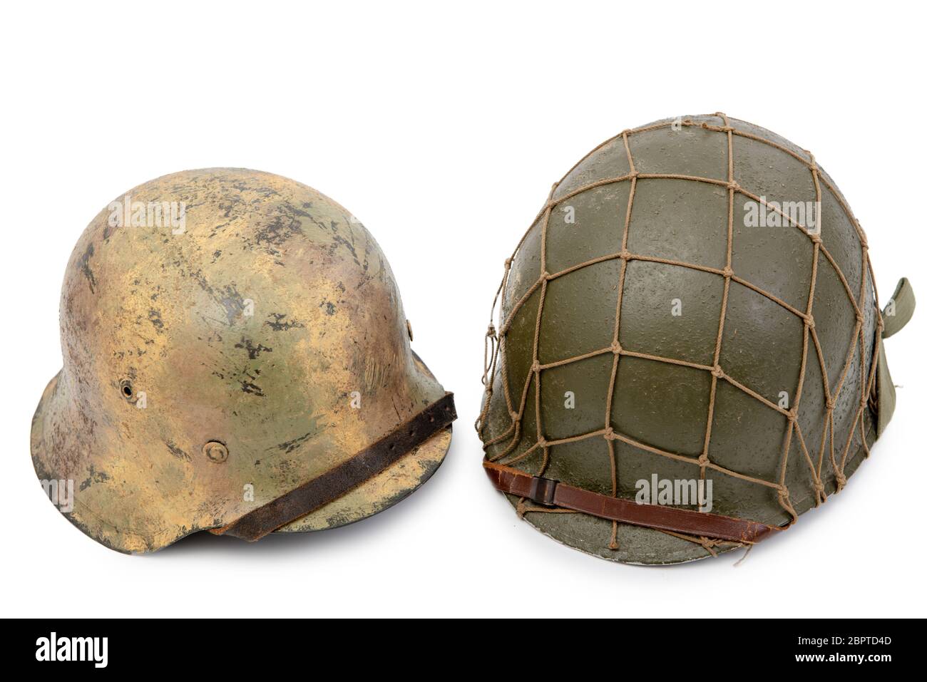 U.S and German World War Two military helmets, a battle of Normandy 1944 Stock Photo