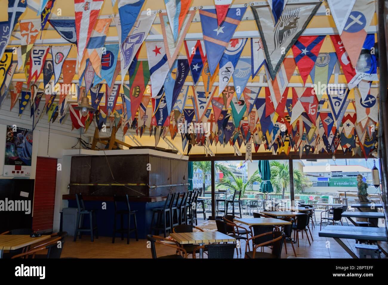 May 2020 - Normally busy, shutters are down at the Sint Maarten Yacht Club Bar & Restaurant while it is closed due to the Covid-19 Pandemic Stock Photo