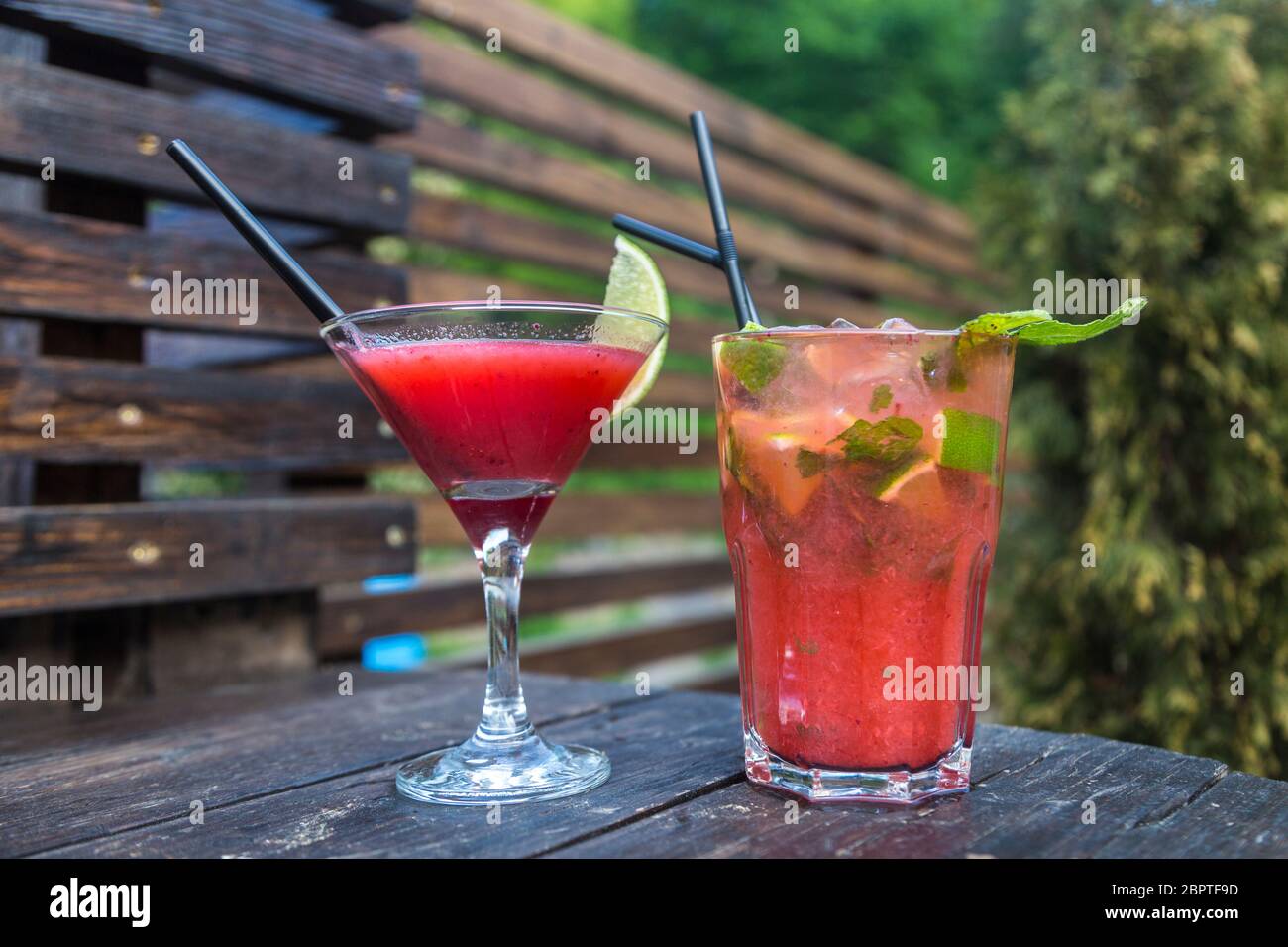 Red strawberry with lime and mint. A fresh summer non alcoholic fruit and berry cocktails. Stock Photo