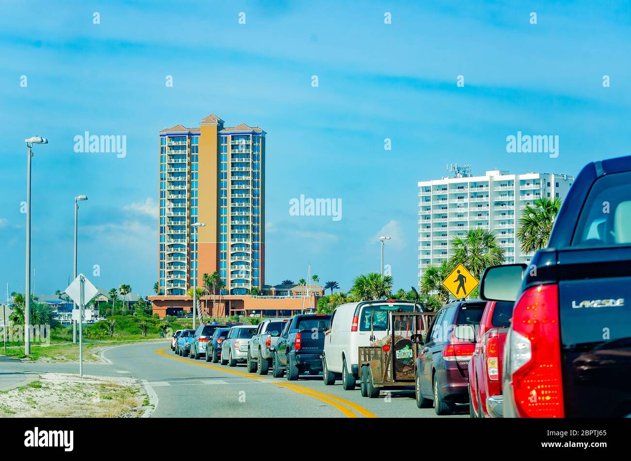 Traffic enters Pensacola Beach, May 16, 2020, in Gulf Breeze, Florida. The beach recently reopened after being closed for the COVID-19 pandemic. Stock Photo