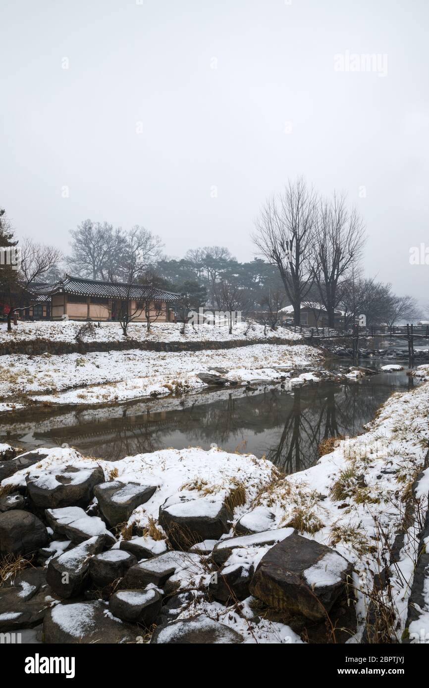 Winter in Korea, snowy traditional village landscape. Oeam Folk Village Chinese Translation. Stock Photo