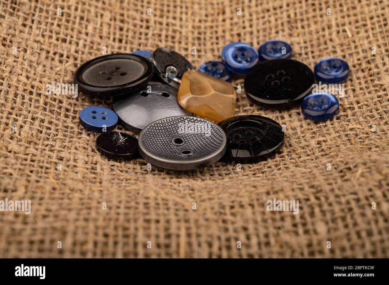 Several multi-colored buttons of different sizes on a background of ...
