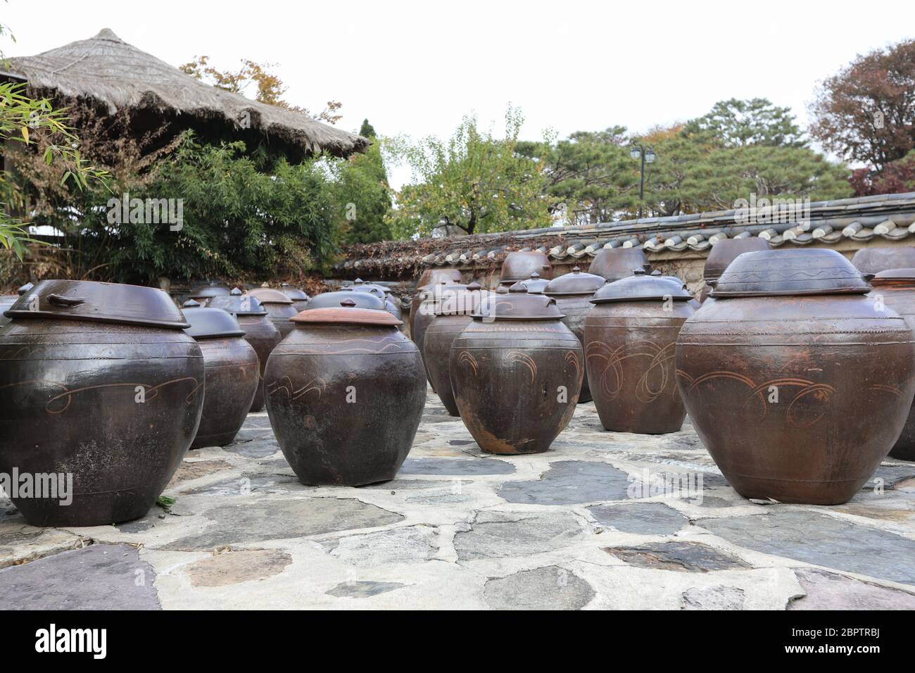 Korean traditional clay pot and stone wall Stock Photo - Alamy