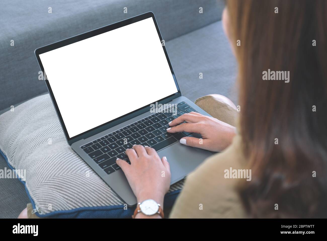Mockup image of a woman using and typing on laptop keyboard with blank ...