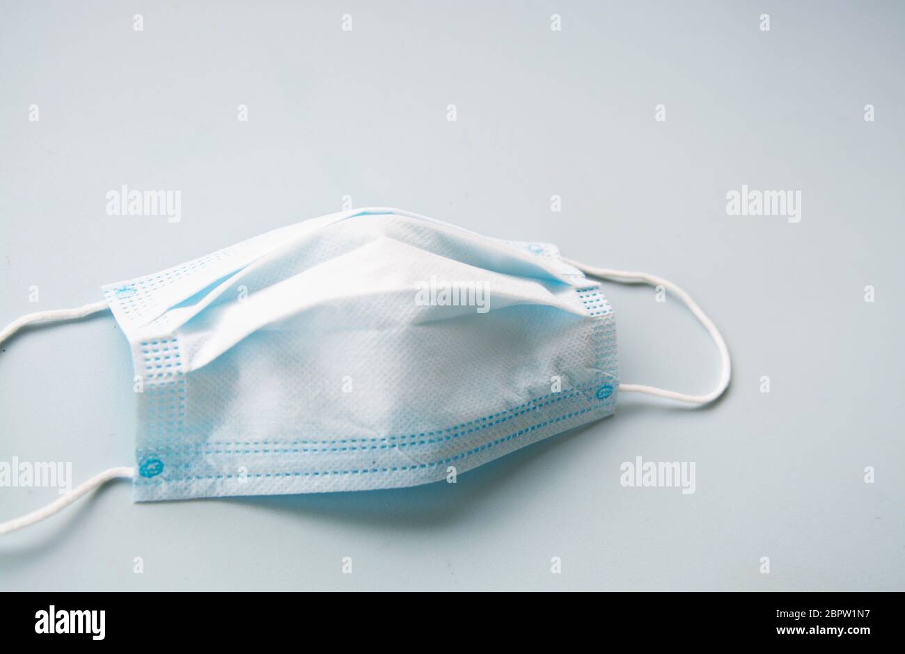 Disposable surgical face mask, protective face mask on a clean white background Stock Photo