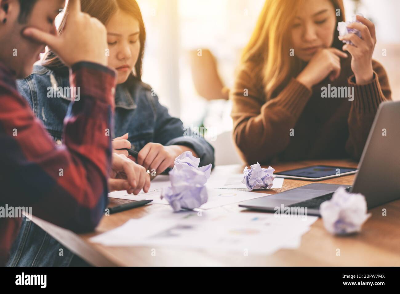 Three businessman get stressed while having a problem in business meeting Stock Photo