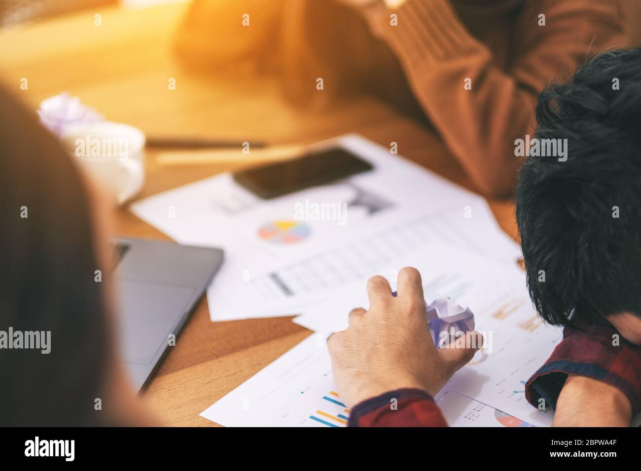 Three businessman get stressed while having a problem in business meeting Stock Photo