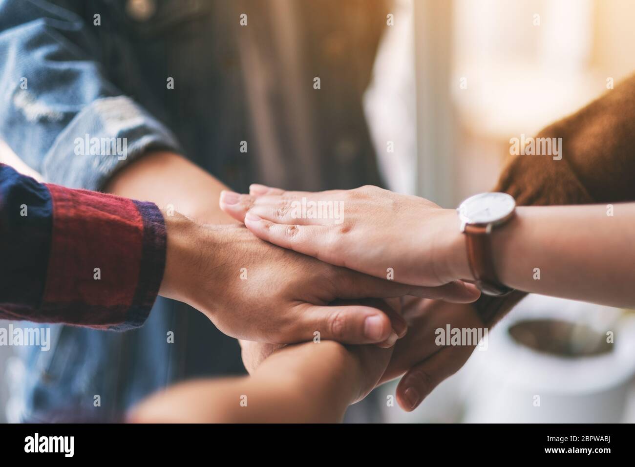 Closeup image of businessman putting their hands together in the meeting Stock Photo