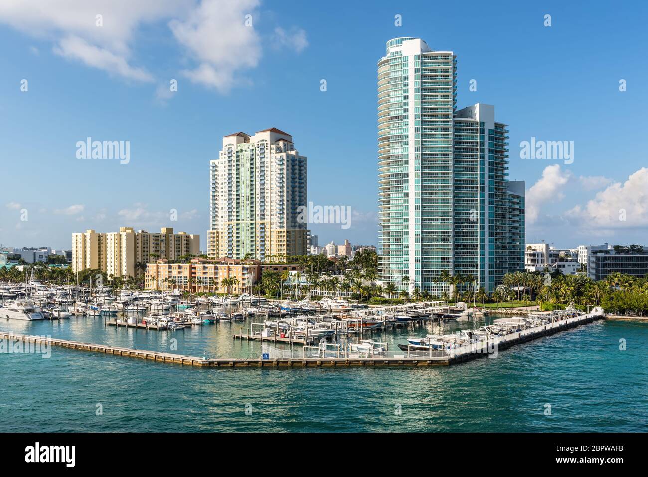 Miami, FL, United States - April 28, 2019: Luxury high-rise condominiums overlooking boat parking on the Florida Intra-Coastal Waterway (Meloy Channel Stock Photo