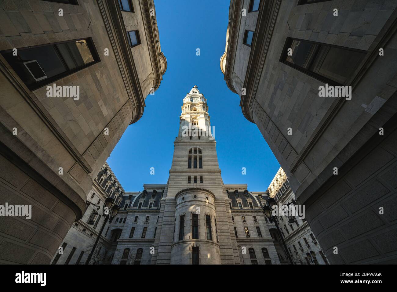 Uprisen angle of Philadelphia city hall with historic building over blue sky background, Pennsylvania, USA or United States of America, Architecture a Stock Photo